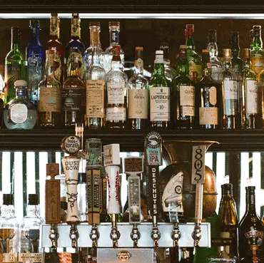 Shelves of spirits and liquor bottles behind the bar
